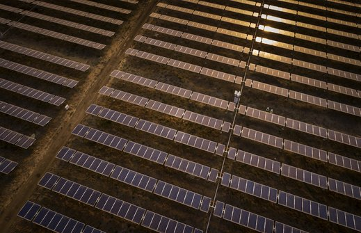Aerial view of a solar farm at golden hour